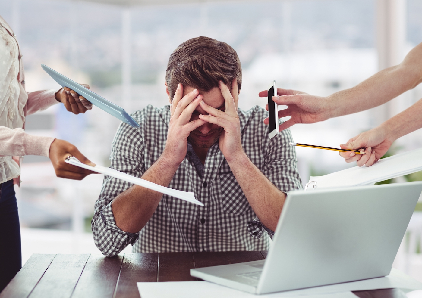 Stressed man frustrated with electronic devices